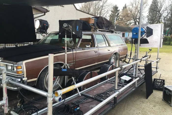 A typical car rig on a trailer. HMI lights into a silver pebble bounce.