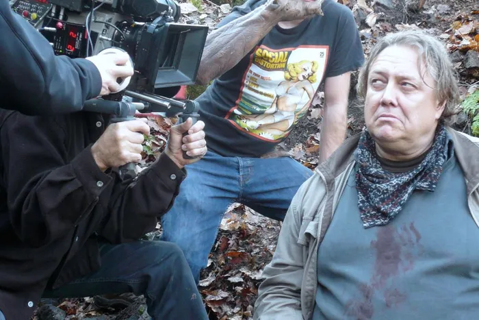 Actor Alan Petrson is about to get clawed by the FX technician.