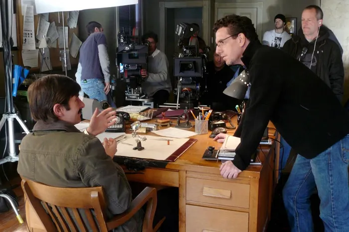 Director Sheldon Wilson works with actor Joe Cobden.