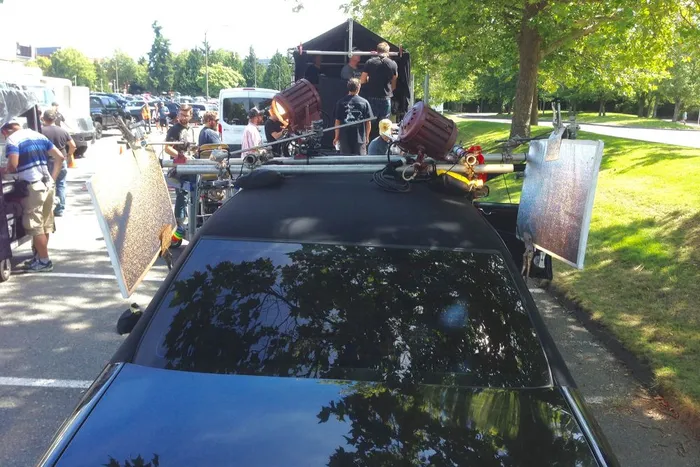 Lighting through the windows of a limo by mounting the lights on the roof.
