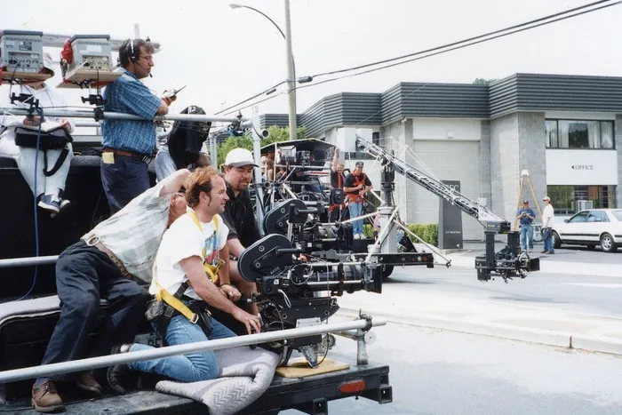 Two 'Shotmaker' camera cars set up for a car chase scene. The farther one has a crane arm and remote control camera head.