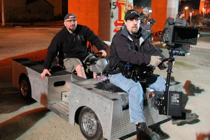 Steve Moore is steadicam on Dave Dibdin's silent camera cart rig. The 'rolling cheeseplate' allows you to mount the camera anywhere.